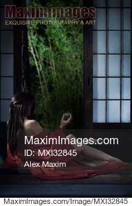 Sexy Asian woman in red kimono drinking tea half undressed...... preview image
