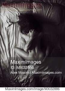 Sexy naked couple making love in bed overhead art nude...... preview image