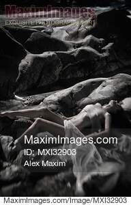 Beautiful nude woman lying by a river her naked body...... preview image