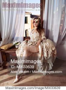 Seductive Venetian lady in carnival mask and beautiful...... preview image
