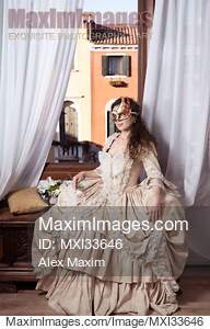 Beautiful young lady in vintage Italian dress and carnival...... preview image