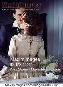 Sensual portrait of a couple, man unlacing corset dress...... preview image