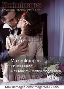 Sensual romantic portrait of a kissing couple. Elegant man...... preview image