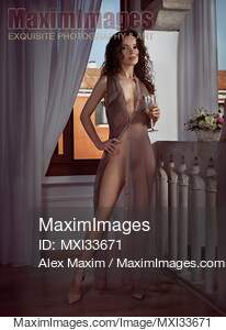Beautiful sexy woman in sheer unbuttoned dress revealing...... preview image