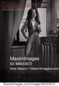 Beautiful sexy woman in sheer unbuttoned dress revealing...... preview image
