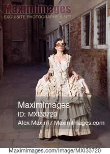 Beautiful lady in vintage Italian dress and carnival mask...... preview image