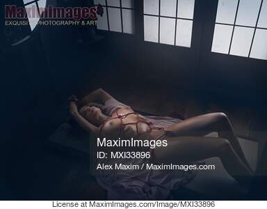 Sensual erotic photograph of a beautiful nude woman lying...... preview image