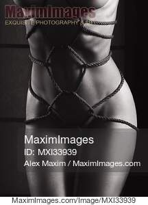 Art nude closeup of beautiful naked woman body with hemp...... preview image