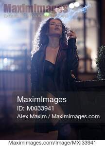 Beautiful seductive woman in black leather coat and sexy...... preview image
