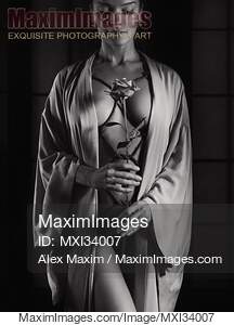 Woman with ropes of Shibari bondage tied around her sensual...... preview image