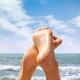 Woman feet in the air at the beach... (thumbnail)