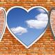 Open heart-shaped window in brick wall... (thumbnail)
