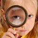Child Looking Through Magnifying Glass... (thumbnail)