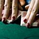 Croupier Shuffling the Cards at a Blackjack Table... (thumbnail)