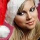 Smiling Young Happy Woman in a Red Christmas Hat... (thumbnail)