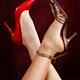 Crossed women legs in sexy high heel shoes... (thumbnail)