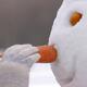 Girl inserting snowman carrot nose... (thumbnail)