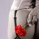 Sexy woman in lingerie with a red carnation behind her back... (thumbnail)