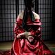 Asian Woman with Her Hands Tied Behind Her Back... (thumbnail)