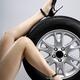 Sexy Woman Legs on a Car Tire... (thumbnail)