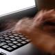 Hands of person typing on computer keyboard... (thumbnail)