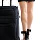 Businesswoman walking with suitcase closeup of legs... (thumbnail)