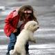 Little Girl with a Dog in Rain... (thumbnail)