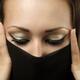 Young Woman Covering Her Face with Scarf... (thumbnail)