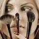 Beautiful Young Woman with Make-up Brushes... (thumbnail)
