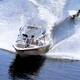 Teenage Girl Wakeboarder Behind a Motorboat... (thumbnail)