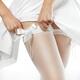 Woman pulling up her white stockings... (thumbnail)
