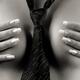 Naked woman wearing tie covering her breasts... (thumbnail)