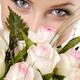 Young Smiling Woman Eyes over Bunch of White Roses... (thumbnail)