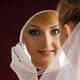 Beautiful Smiling Woman in Bridal Veil Looking in Mirror... (thumbnail)