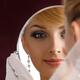 Young Woman Bride Looking in Mirror... (thumbnail)