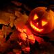 Scary Jack-o-lantern Illuminated From Inside on Autumn Leaves... (thumbnail)