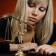 Woman Playing with Justice Scales... (thumbnail)