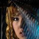 Woman face behind black curtain... (thumbnail)