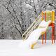 Snow covered slide on playground in winter... (thumbnail)