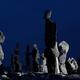 Stone figures over dark night sky... (thumbnail)