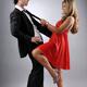 Young woman pulling playfully young mans tie... (thumbnail)