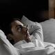 Young Man Lying in Bed Alone... (thumbnail)