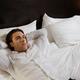Young Man Lying Alone in Bed... (thumbnail)