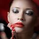 Beautiful Woman Smearing Lipstick... (thumbnail)