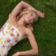 Young Woman Lying on Grass... (thumbnail)