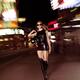 Attractive Young Woman Walking Down the Street at Night... (thumbnail)