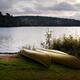 Canoe on a Shore of a Lake at Dawn... (thumbnail)