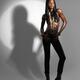 Attractive Woman Standing in a Spot Light... (thumbnail)