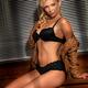 Sexy Young Woman in Black Lingerie Sitting on a Window Sill... (thumbnail)