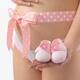 Pregnant Woman Holding Pink Baby Shoes... (thumbnail)